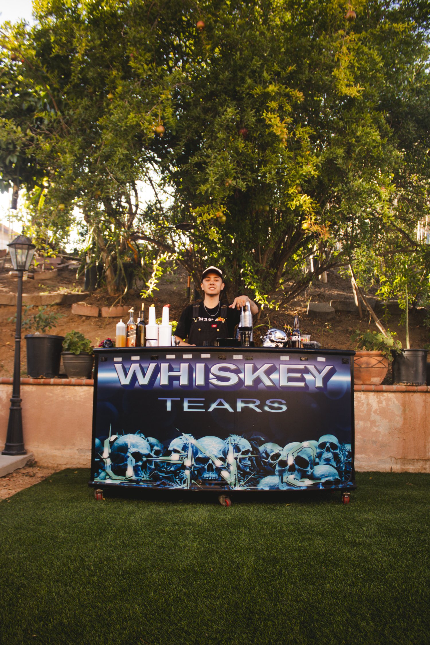 Bartender behind the Whiskey Tears mobile bar